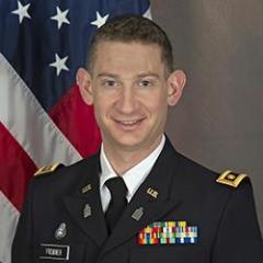 Major Cantor David Frommer in his US Army Uniform in front of an American Flag