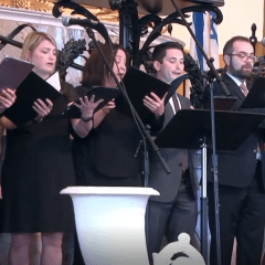 ACC members singing in an ensemble for the concert