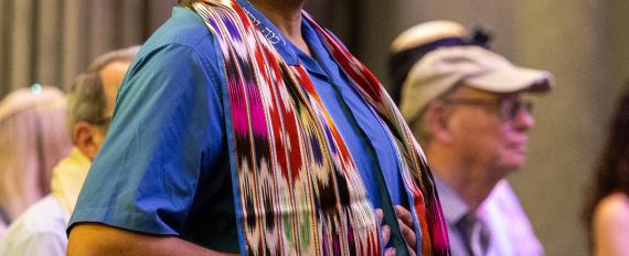 Man in tallit and hat singing during service